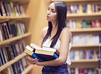 Student woman with library books university, education and thinking or learning for knowledge, scholarship research. Studying, reading lifestyle gen z with creative art print book in hands and shelf
