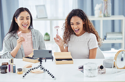 Buy stock photo Happy influencer doing makeup review video podcast for online beauty blog or vlog using her phone at home. Female content creator or influencer live streaming her cosmetic skills for social media