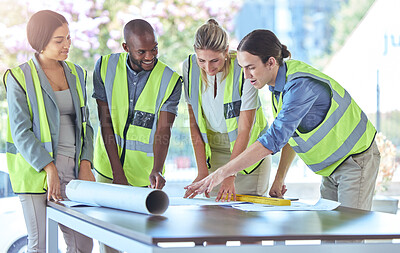 Buy stock photo Industrial engineer team planning with blueprint paperwork in a meeting in an office or boardroom. Architect group of people collaborate on a building project working together on the design