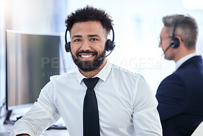 Buy stock photo Call center, office and contact us of a businessman in customer support with happy smile in the workplace. Portrait of a telemarketing employee working in the communication business at work in tech.