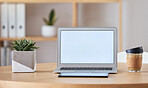 Mockup laptop, coffee and tablet on desk at home office of  freelance SEO, UX or digital social media marketing and advertising freelancer. Internet or online work from home remote worker workspace