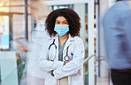 Compliance, healthcare and covid face, mask rules with proud doctor working in a hospital, ready and confident. Health care professional leader work during pandemic, focused on helping sick people