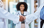 Diversity doctors handshake thank you, trust or collaboration hands for success with medical worker smile lens flare and bokeh. Healthcare employee shaking hands for promotion, innovation or research