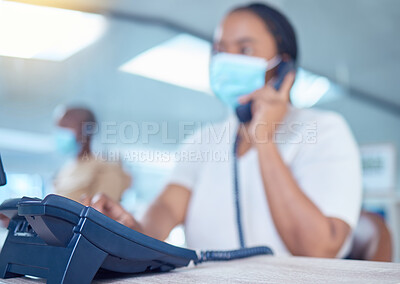 Buy stock photo Business woman or receptionist on phone call with a mask for covid, corona or virus safety. Company office worker in startup workplace consulting or communication with client about telemarketing sale