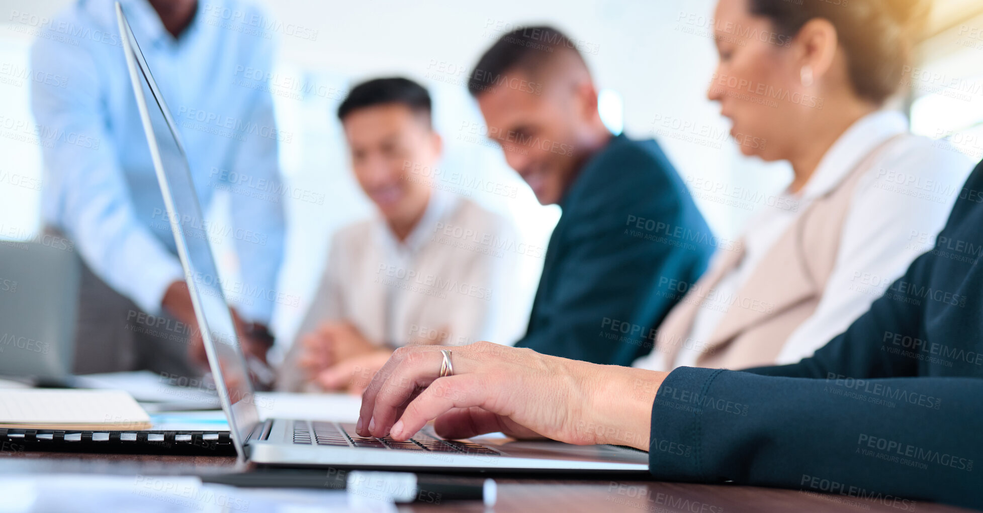 Buy stock photo Business woman hands typing email on laptop in a team planning or strategy meeting in a corporate work office. Teamwork, collaboration and support while talking at a desk and consulting together
