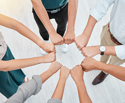 Buy stock photo Teamwork, hands and collaboration with a team working together and standing in a huddle in the office. Solidarity, unity or trust and a group of staff with motivation and a goal for company success