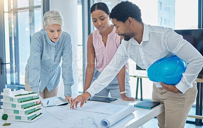 Buy stock photo Design, construction and an architect in an office with blueprints, a city planning and strategy meeting. Architecture, engineering and apartment building plans, teamwork and  communication at work.