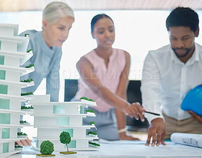 Buy stock photo Architect or engineer team planning and designing a building in a meeting in the office or boardroom. City development planner or architecture group with a 3d model and working on a strategy