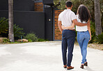Property, real estate and new home with a man and woman homeowner looking at their house together outside. Property, real estate and an investment in their future with a couple standing on a driveway