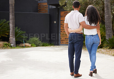 Buy stock photo Property, real estate and new home with a man and woman homeowner looking at their house together outside. Property, real estate and an investment in their future with a couple standing on a driveway