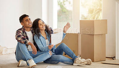 Buy stock photo Couple happy on the floor of their new property or house in the living room with box in the background. Real estate owner smile inside the lounge interior thinking of idea for renovation at home