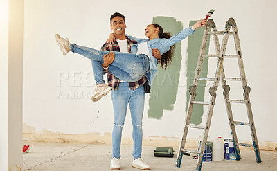 Buy stock photo Diy, home improvement and wall painting with happy couple renovating house and having fun together. Playful husband and wife being silly and goofy, enjoying their relationship and project together