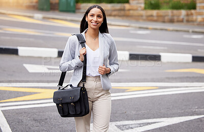Buy stock photo Business woman crossing the street during her walk to work with a briefcase bag outdoors in summer. Happy, corporate and professional employee taking stroll to the company office building in the city