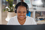 Customer service agent, worker and employee working in telemarketing, helping people online with advice and consulting on computer. Face of a happy African call center consultant giving support