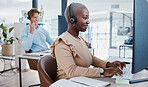 Black call center, telemarketing, and customer service consultant typing on computer for database information a busy office. Contact us and crm agent offering support, help and service with a smile

