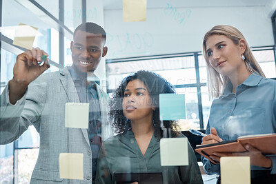 Buy stock photo Sticky notes, corporate and business people planning a team project on a glass wall in an office. Diversity, collaboration and creative employees having a strategy, idea and solution meeting.