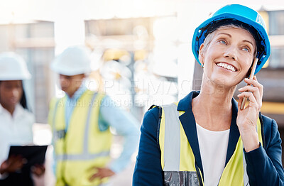 Buy stock photo Happy architect talking on a phone call, smiling while standing at a construction site outdoors. Industrial project manager discussing goal and strategy, excited about building design and plan