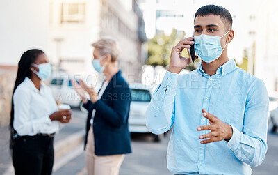 Buy stock photo Covid, medical mask and phone call businessman talking on 5g network, mobile or smartphone outside with team in background. Communication, teamwork and collaboration with worker on cellphone.