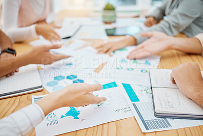 Buy stock photo Marketing and advertising team planning strategy with paperwork or document in a meeting in an office. Teamwork and collaboration in a business meeting discussing profit and data graphs on paper 