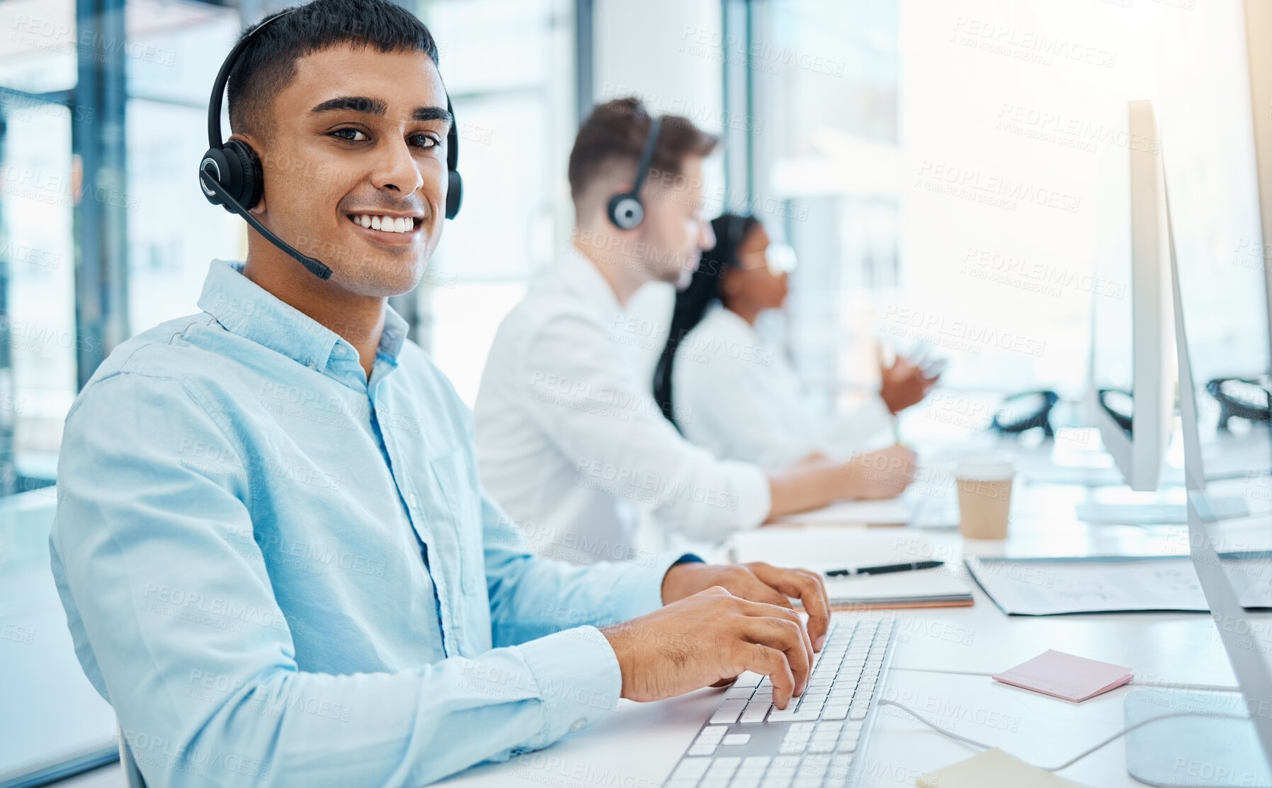 Buy stock photo Sales man, call center agent and customer service support operator giving advice, help and expert communication while working in office. Portrait of young consultant, crm telemarketing and contact us