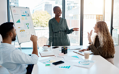 Buy stock photo Black business woman giving a presentation with data, charts and graphs at a team meeting. Diversity, creative and marketing workers and manager planning a work project in the corporate office.
