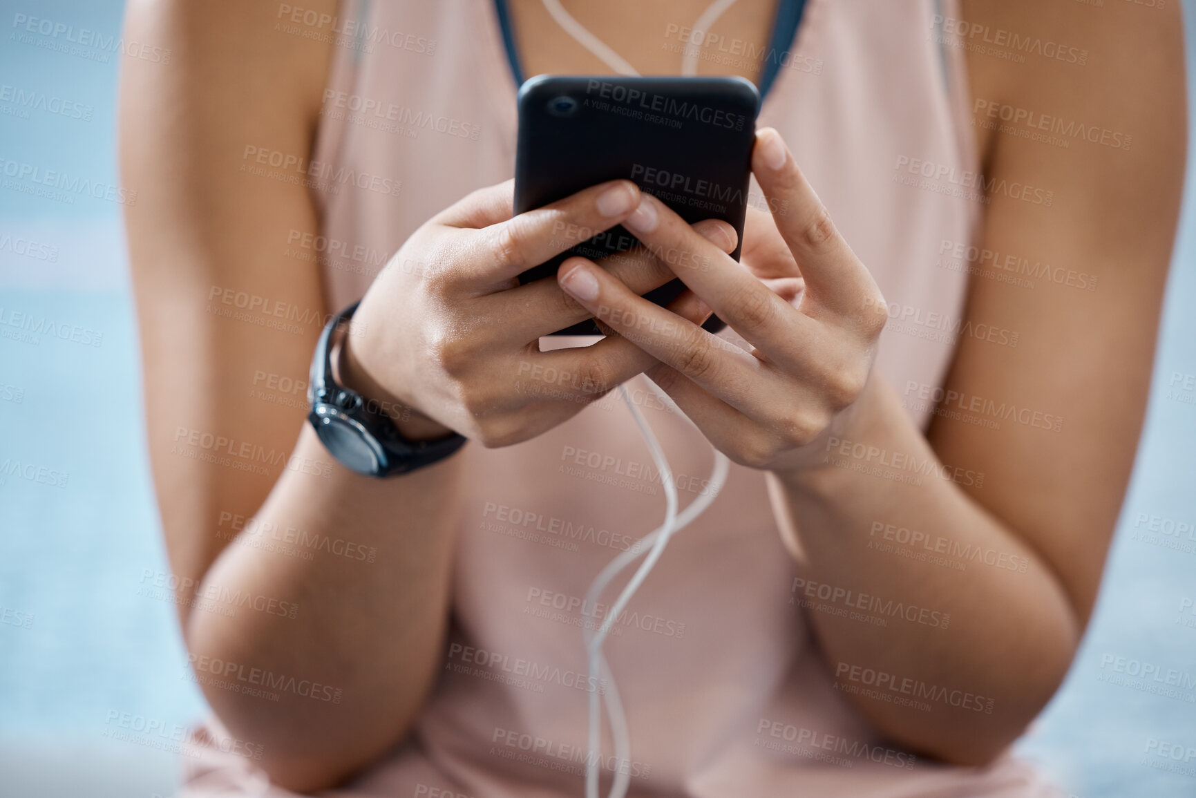 Buy stock photo Fitness app, phone and communication while typing on phone in sportswear to track progress on smart device with fast network. Close up hands of a woman listening to music or podcast during training