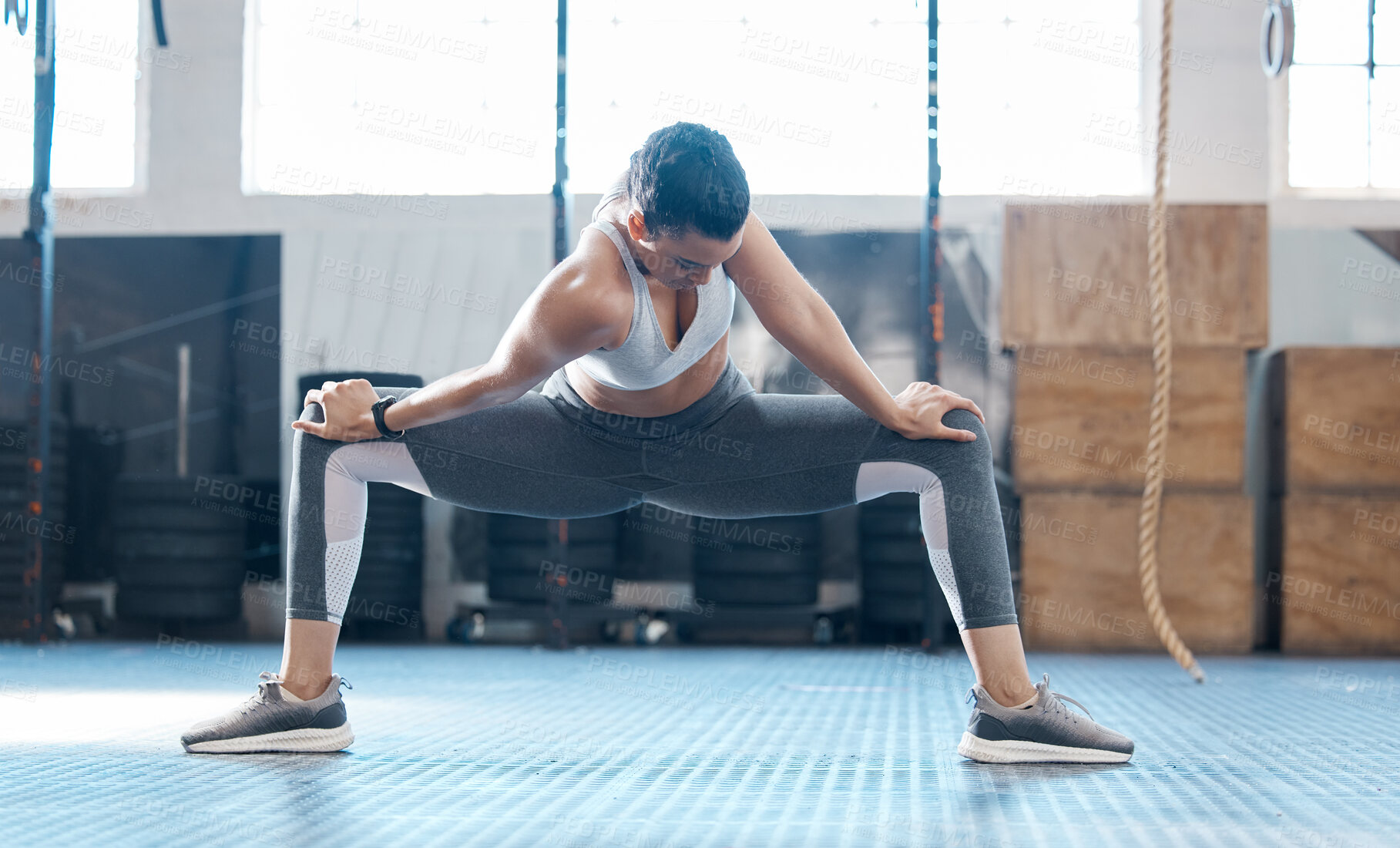 Buy stock photo Gym, woman and stretching legs exercise before workout session training for injury prevention. Girl doing joint and muscles warm up for athlete performance and recovery from active fitness.