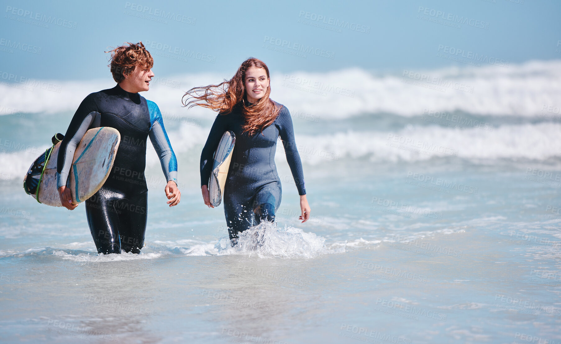 Buy stock photo Surf, sea and love with a couple in the ocean water for surfing, fun and dating. Sport, dating and nature with a young man and woman with a surfboard on holiday or vacation outside in nature
