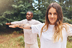 Fitness, zen and yoga couple exercise outdoors in park or forest together, bonding while living a healthy lifestyle. Interracial girlfriend and boyfriend training balance and posture while meditating