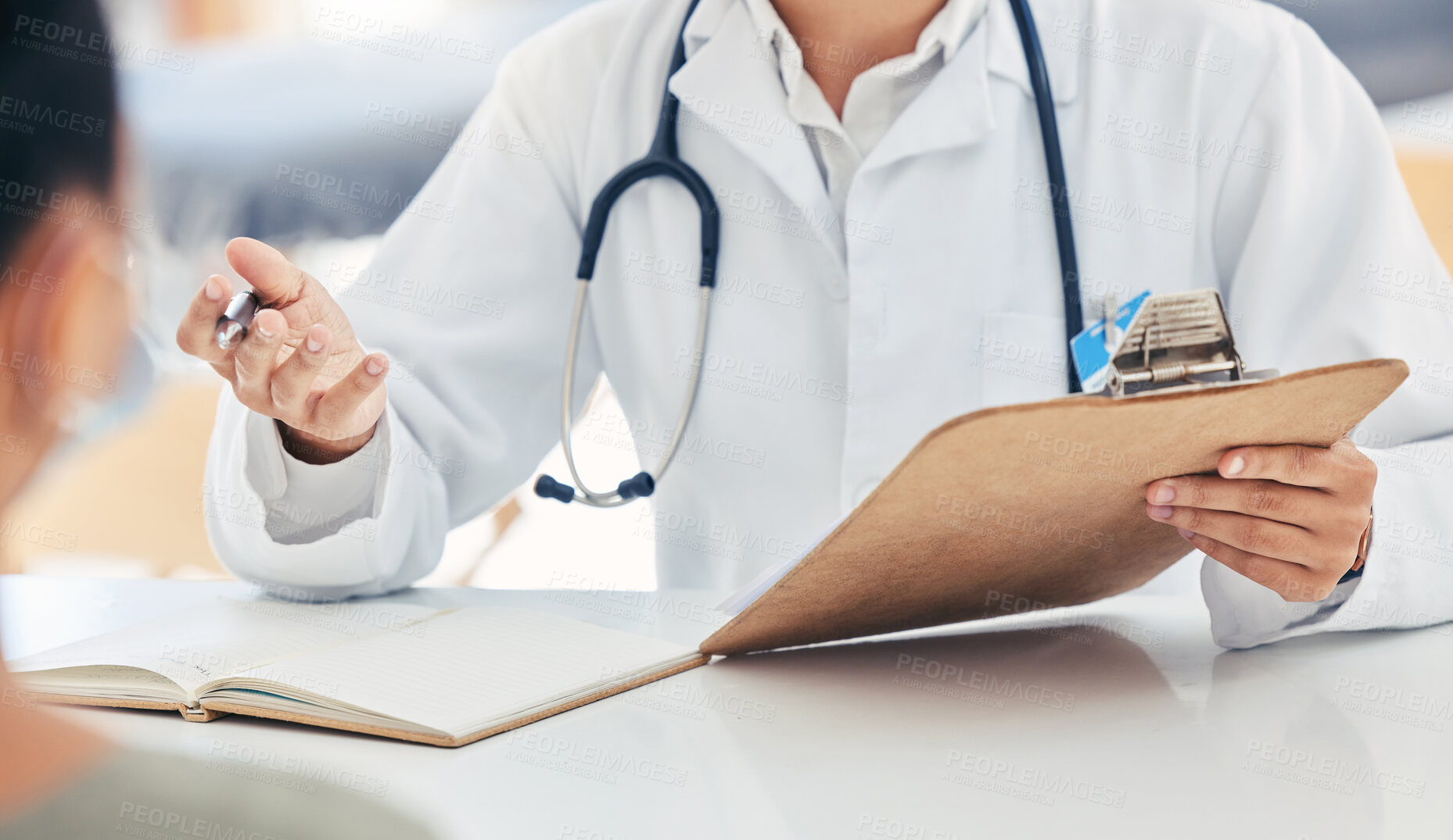 Buy stock photo Doctor talking about health insurance at clinic, healthcare worker in meeting with sick patient and medical professional giving service. Consultant planning with documents in consultation at hospital