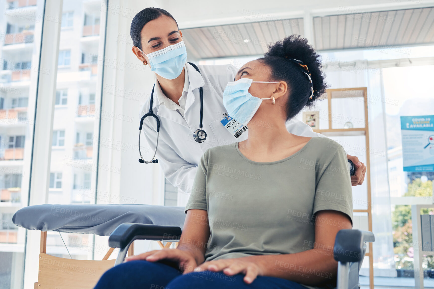 Buy stock photo Nurse helping covid patient in a wheelchair after medical treatment in a hospital room. Healthcare employee helping a disabled person in the clinic ward. Doctor consulting woman with coronavirus.