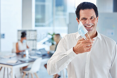 Buy stock photo Covid, health and freedom, mask off for man in office after lockdown. Portrait of a happy businessman putting a face mask on to curb spread of virus in workplace and protect employees from infection.