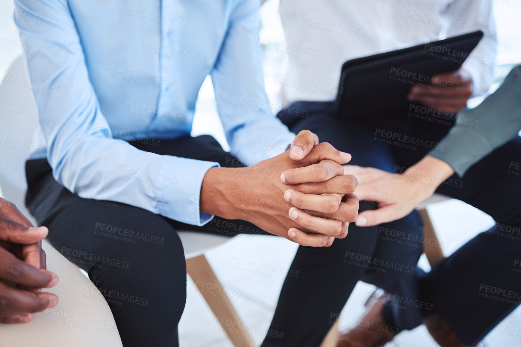 Buy stock photo Stress, anxiety and hands with a man in a counselling meeting for trust, support and mental health. Accountability, communication and healthcare with a group sitting and talking about grief or trauma