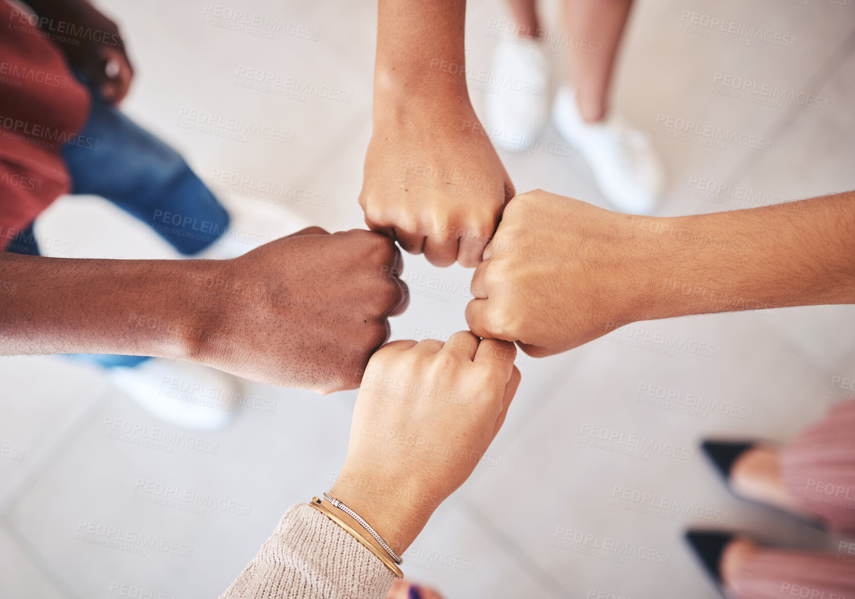 Buy stock photo Hands, teamwork and collaboration with a team of business people joining their fists in a circle in solidarity, unity and support from above. Motivation, goal and a mission or vision for success