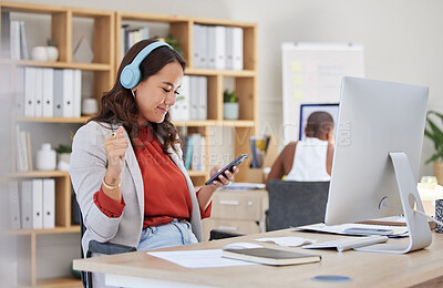 Buy stock photo Employee, on phone and headphones in office listening to music while browsing social media. Happy and excited business woman with smile receives good news on her mobile device in corporate building 