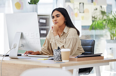Buy stock photo Thinking, attention and business woman on computer working by desk in design company office building. Idea, vision and innovation with employee reading email or looking at work online 