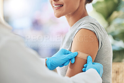 Buy stock photo Band aid, vaccine or injection for covid and global virus in security, safety or wellness insurance. Doctor hands, medical employee or healthcare worker with plaster for happy or smile hospital woman