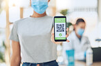 QR code for covid 19 vaccination passport and certificate at covid vaccine center or site for health and safety verification. Hands of young girl with smartphone for approval or confirmation document