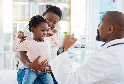 Buy stock photo Pediatrician doctor with black family, baby and mother in clinic or hospital checkup appointment for growth wellness. Child in strong muscle flex for calcium with fun male medical pediatrics expert