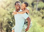 Love, date and outdoor couple in park or romantic nature outing for healthy, green lifestyle with trees, bokeh and lens flare. Happy, wellness black people and caring man giving woman piggyback ride