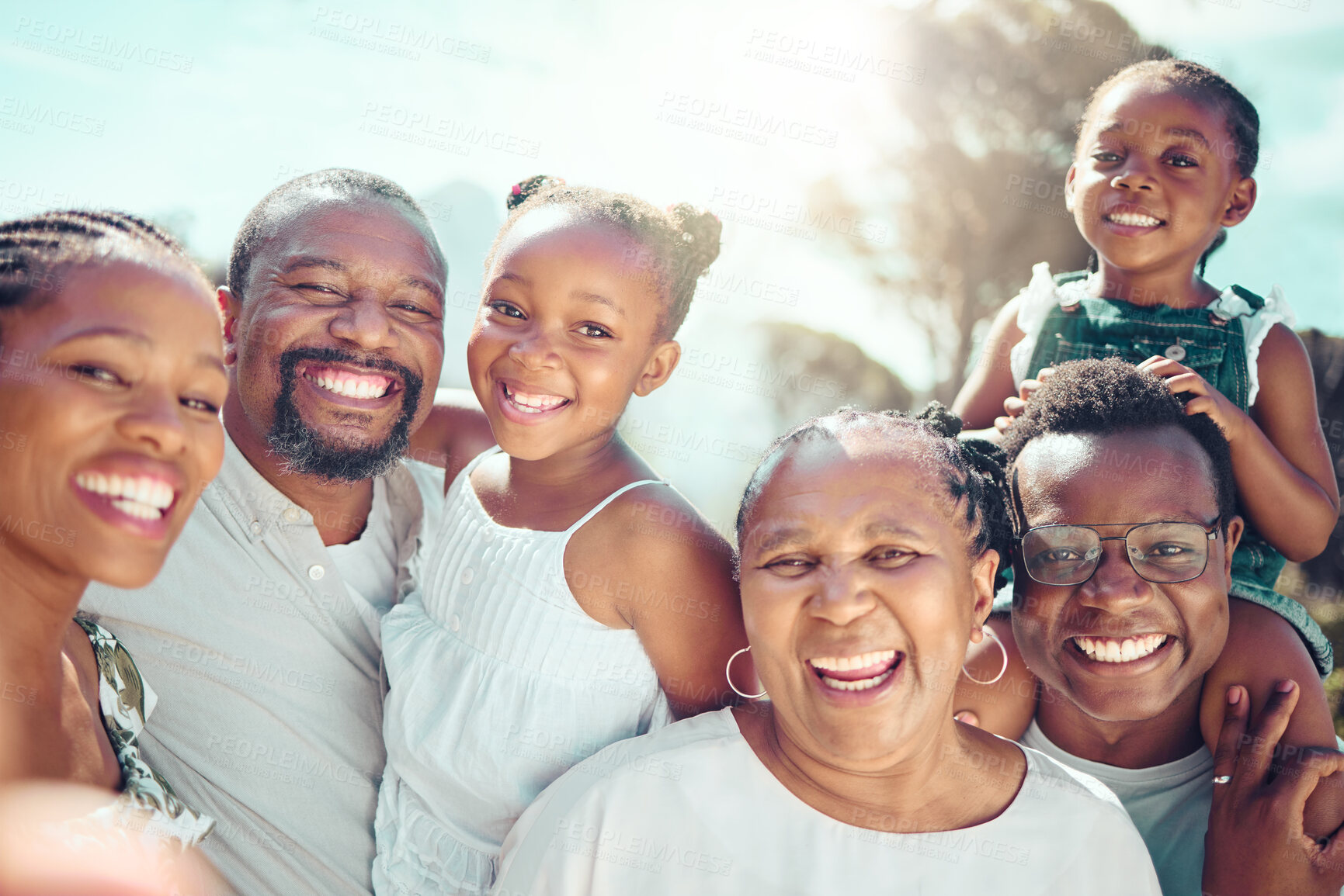 Buy stock photo Portrait, happy black big family and love as they smile on vacation, trip or holiday. Ancestry, African people or grandparent, fathers and mother with kids together in the shining sun or sunshine.

