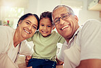 Grandparents, grandkid and family smile, happy and playing together at home. Portrait face of love, bond and relaxing elderly grandma, grandpa and young kid for funny, care and childhood development
