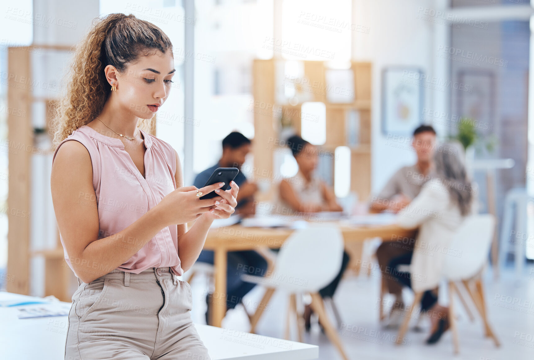 Buy stock photo Phone, digital and technology obsession of a office business woman on a social media break at work. Digital marketing employee searching through mobile web and internet content while staff is working