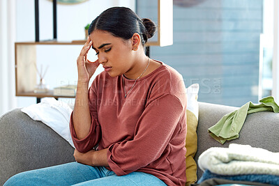 Buy stock photo Stress, woman and headache on sofa, depression and mental health in lounge. Female holding head, anxiety and burnout in living room, suffering from mental illness and sad at home with pain or anxious