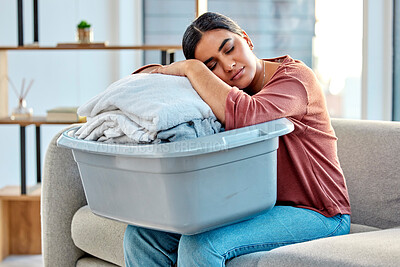 Buy stock photo Woman, sleeping and laundry basket on sofa from cleaning, folded washing clothes or housework at home. Tired woman asleep on washed clothing or garments from housekeeping, hygiene or living room rest