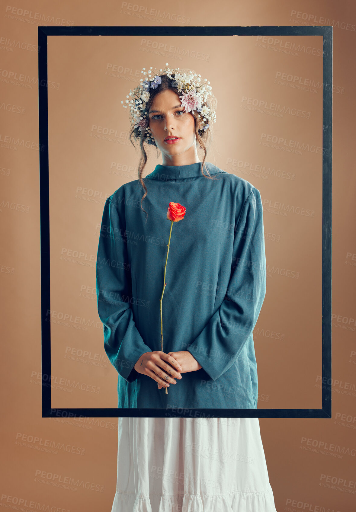 Buy stock photo Woman, floral crown and studio with frame, rose or beauty for fashion in portrait by background. Model, girl and flowers in spring, clothes or design with red rose plant in hands by studio background