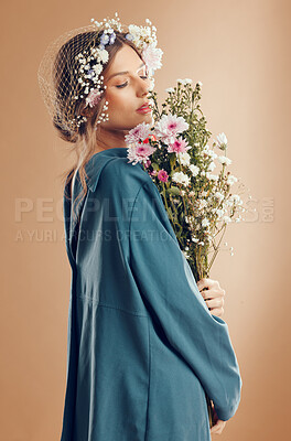 Buy stock photo Floral crown, fashion and woman with flowers in studio isolated on a brown background. Beauty, makeup and aesthetics of female model from Canada in dress with plants or organic cosmetics for skincare