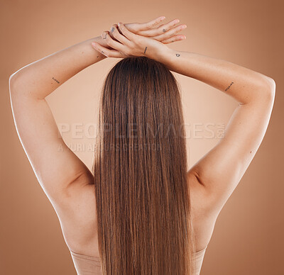 Buy stock photo Woman, hair and beauty in cosmetics studio with long hair, treatment and self care by brown background. Model, natural hair care and balayage for cosmetic, extension or wig  by studio background