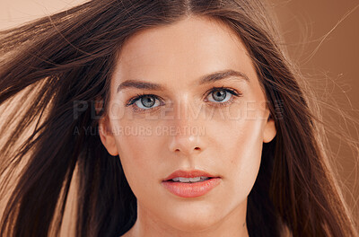 Buy stock photo Woman, cosmetic beauty and skincare portrait with brunette, hair and makeup by studio background. Model closeup, radiant glow skin and cosmetics for wellness, self care or healthy dermatology of face