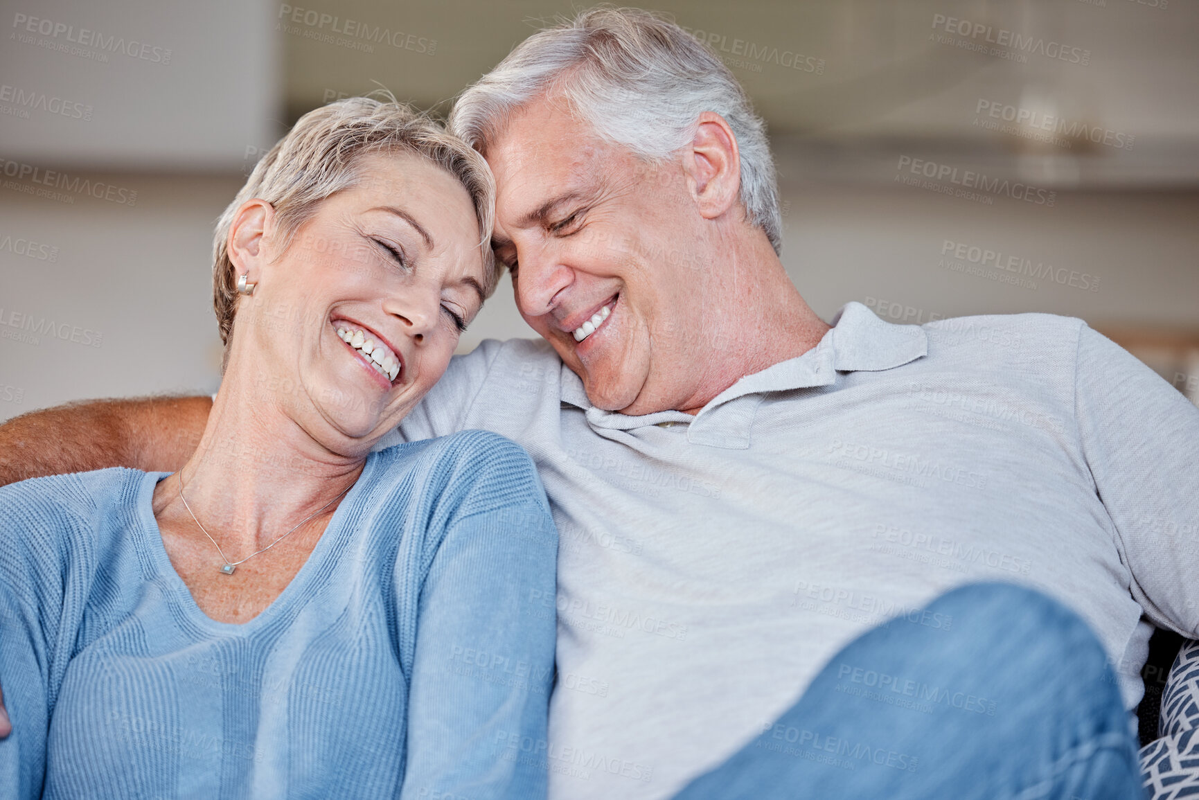 Buy stock photo Love, smile and senior couple in living room home, bonding or cuddle. Romance, affection and retired, elderly and happy man and woman in lounge, having fun and enjoying quality time together in house